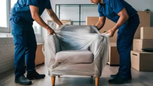 two-men-are-wrapping-piece-plastic-from-couch_1040470-15908.webp